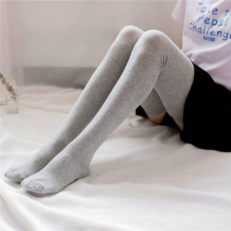 femboy thighs in light gray thigh highs